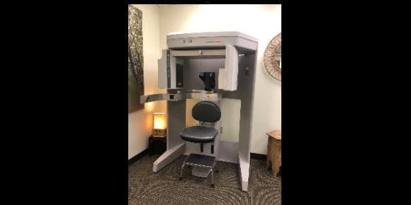 A cone beam CT (CBCT) imaging machine with its patient seat